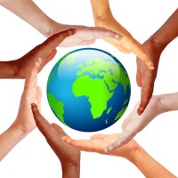 Hands around earth, international friendship concept Hands around earth, international friendship concept
